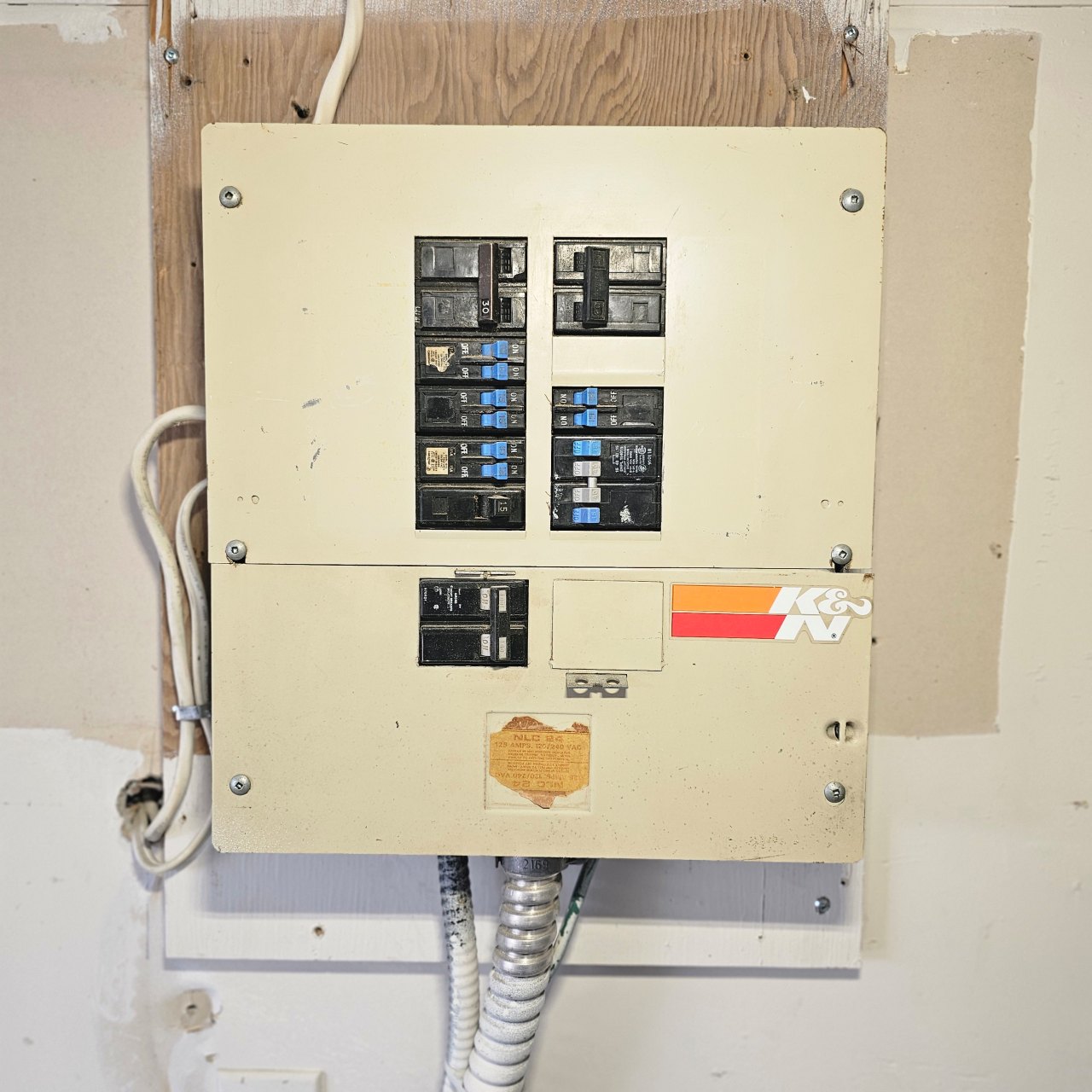 Existing electrical panel before replacement by Tigley Electrical Services